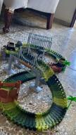 img 1 attached to 159 Pcs Dinosaur Glow In The Dark Race Train Track Toy For Boys & Girls Ages 3-7 | DinoManiacs By JitteryGit review by Jon Estell