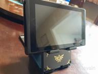 img 1 attached to Officially Licensed Nintendo & Pokemon Pikachu Playstand For Switch - Compact And Stylish In Black & Gold review by Brandon Fernandez