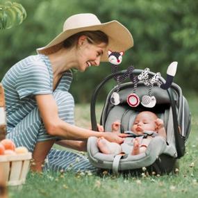 img 1 attached to Развлеките своего ребенка на ходу с черно-белой спиральной игрушкой лисы для автомобильных сидений и кроваток!