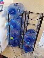 img 1 attached to LIANTRAL 5 Gallon Water Jug Holder Water Bottle Storage Rack, 4 Tiers, Black review by Eli Saumell