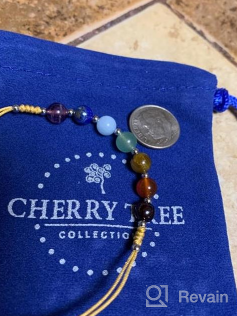 img 1 attached to Cherry Tree Collection Chakra Bracelet with Natural Gemstones, Adjustable Nylon Cord, 6mm Beads, Silver Spacers, Fits 5"-6.5" Women, Girls, and Children review by Chris Morgan