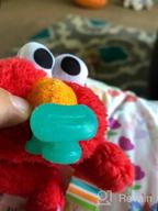 img 1 attached to Bright Starts Sesame Street Cozy Coo Soothing BPA-Free Pacifier With Plush Toy - Elmo, Ages Newborn + , Green , 4.42X2.04X4.17 Inch (Pack Of 1) review by Candace Ramirez