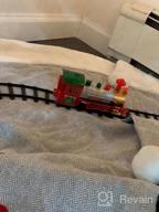 img 1 attached to Experience The Magic Of The Holidays With PUSITI Classic Christmas Train Set - Battery Operated Locomotive Engine And 11.5 Ft Tracks With Lights And Sounds For Kids' Delight review by Jason Pruett