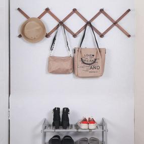 img 2 attached to Expandable Wooden Coat Rack And Accordion Hanger With 20 Pegs, Modern Wall Mount For Hats And Jackets, Walnut Finish By SKOLOO