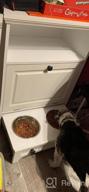 img 1 attached to Stylish White Farmhouse Pet Station With Pull Out Bowls & Storage Cabinet For Modern Pet Care review by Amrozi Papi