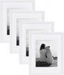 create a stunning wall display with designovation gallery wood photo frames - white, 11x14 matted to 8x10, pack of 4 logo