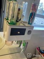 img 1 attached to Wall-Mounted Toothbrush Holders With Automatic Toothpaste Dispenser For Kids, Electric Toothbrush Organizer With Storage Drawer And 6 Slots, Including 3 Covered Cups By Yoobure review by Julia Turner