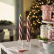 luminara set of 2 candy cane glitter stripe white flameless candle tapers - melted top real wax with red glitter swirl, unscented, timer, remote ready logo