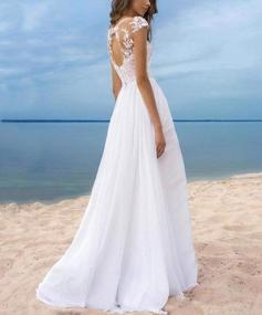 img 2 attached to Elegant Beach Wedding Dress: Modest Lace Cap Sleeves, High Split & Lace-Up Back Long Gowns
