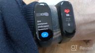 img 1 attached to Smart Xiaomi Mi Band 7 Global bracelet for Russia, black review by Kasem Thongnoi ᠌