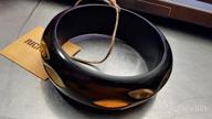 img 1 attached to 🖤 Richera Black Resin Bangle with Brass Metal Leaves Inlay review by John Faxon