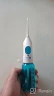 img 2 attached to Irrigator Dentalpik Easy Clean: Ultimate Solution for Effortless Dental Hygiene (White/Blue) review by Adam Komosa ᠌