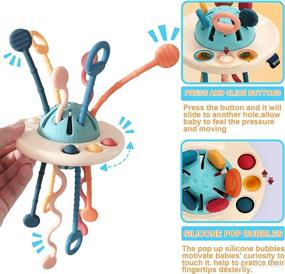 img 1 attached to 🚀 1-5 Year Old Montessori Sensory Toy, UFO Food Grade Silicone Pull String Activity Toy for Toddlers, Travel Toy for Boys and Girls, Ideal Christmas Birthday Gift for Kids 1-3 Years