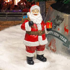 img 1 attached to Рождественские коллекционные фигурки Санта-Клауса из смолы с солнечными огнями - веселые и праздничные украшения для стола для рождественского декора дома и ванной комнаты - набор из 12 штук