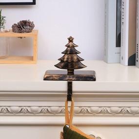 img 1 attached to Стильные и надежные: держатели для рождественских носков Amooca с нескользящими металлическими крючками для декора каминной полки
